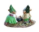 Two happy mouse gnomes find a pot of gold in a lucky clover patch rear veiw